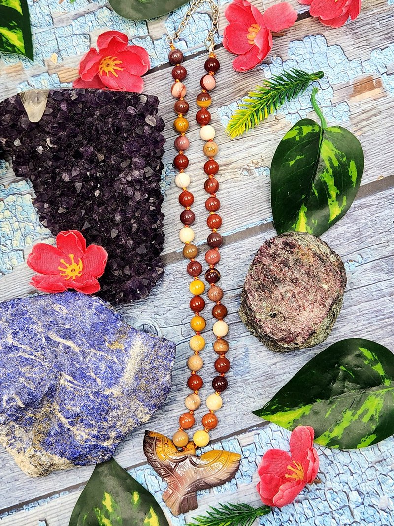 Mookaite Jasper Bead Mala with Mookaite Jasper Phoenix Pendant – Symbolism and Artistry Mookaite Jasper Bead Mala with Mookaite Jasper Phoenix Pendant – Symbolism and Artistry
