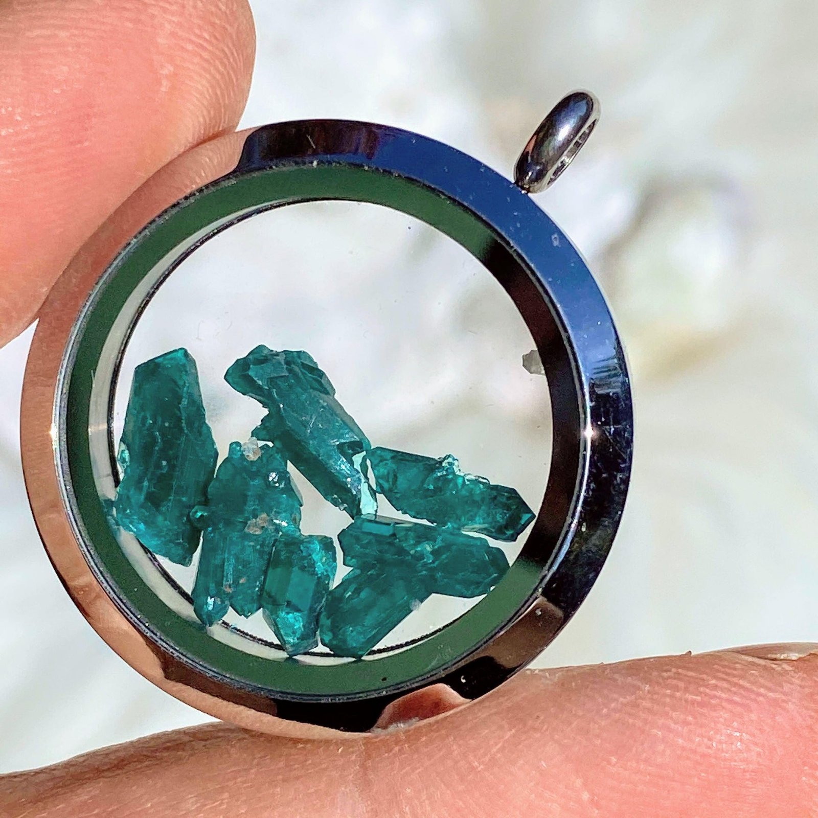 One Dioptase Floating Crystals in Stainless steel/Glass Locket pendant